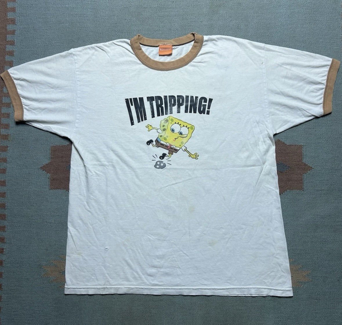 ArtofSpongeBob2's tweet photo. A SpongeBob “Tripping” shirt from 2003. https://t.co/Akco574N5l