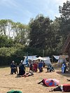AngloSaxonPast's tweet photo. An eight-year-old made me see this Anglo-Saxon village differently

I’ve just taken my young nephew to West Stow, near Bury St Edmunds in Suffolk, where reconstructed buildings stand on the site of a real Anglo-Saxon settlement occupied roughly 1,400-1,600 years ago.

I thought I would be the one slowing everyone down with questions. I was wrong.

Inside the reconstructed village, he wanted to know what everything did. How did people make things? Where did they sleep? Why were the buildings shaped like this?

And suddenly the clever part of West Stow clicked for me too.

These are not surviving Anglo-Saxon houses pretending to be untouched originals. They are experimental reconstructions informed by the archaeology excavated here. Building, using and watching them age has helped researchers test ideas about how early English buildings might actually have worked.

That distinction somehow made them more interesting, not less.

A loom, a hearth or an ordinary wooden doorway began doing more for us than a list of kings ever could. You start thinking about the people who had to weave clothes, keep warm, repair things and get through an ordinary wet week in Suffolk.

My nephew kept firing off questions and getting proper answers. By the end, he was completely absorbed.

I went expecting to explain Anglo-Saxon England to a child. Instead, his curiosity reminded me why I enjoy this period so much in the first place.

West Stow is a wonderful place to let the small questions take over. I’d happily lose an afternoon there again.