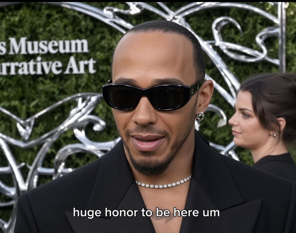 sa10nee's tweet photo. Lewis Hamilton’s response when asked why he has a Beyoncé name tattooed on his chest.

🗣️: “Nah, that’s not what it says.” Lewis fully reveals the whole tattoo, showing the text on it. “You can see for yourself. The whole text says ‘Dream Beyond Limits,’ not Beyoncé. There’s no way I can have Beyoncé’s name on my chest, lol. Although she was my crush when I was young, Kim wouldn’t allow me to have another woman’s name on my chest, even if I thought about it.”