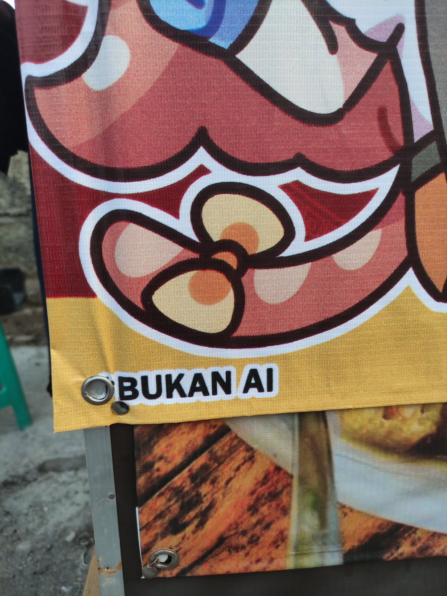 Rutorifuki's tweet photo. Mom: "can you design a simple banner for the mie ayam stall?"

Me: *proceeds to add anime cat waifu mascots and stickers* https://t.co/6yYgqUTlxh