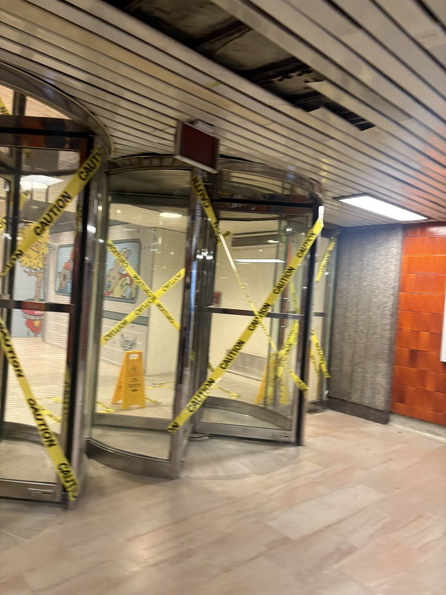 ColeKat14's tweet photo. The TTC needs to address the state of Queen Station. Doors are damaged, entrances are taped off and the whole area looks neglected. This is one of Toronto’s busiest stations. What exactly is the timeline for fixing this? @TTChelps https://t.co/EqqWCq9x70