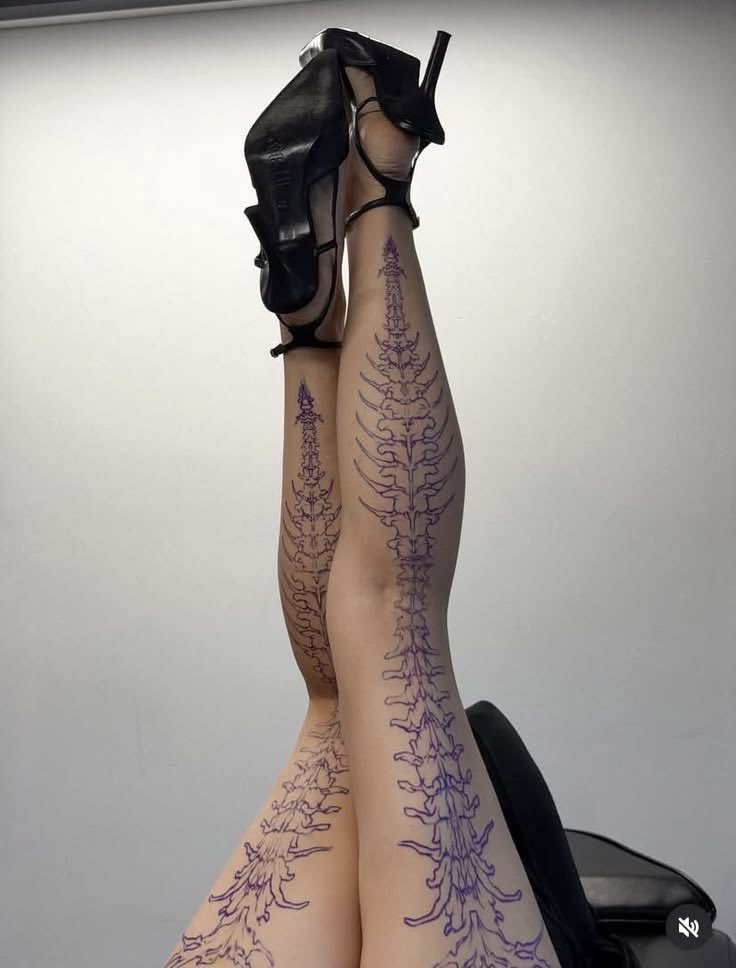 gothicornate_'s tweet photo. detailed spine and vertebrae tattoo running down the legs https://t.co/vzgzQyzNQn