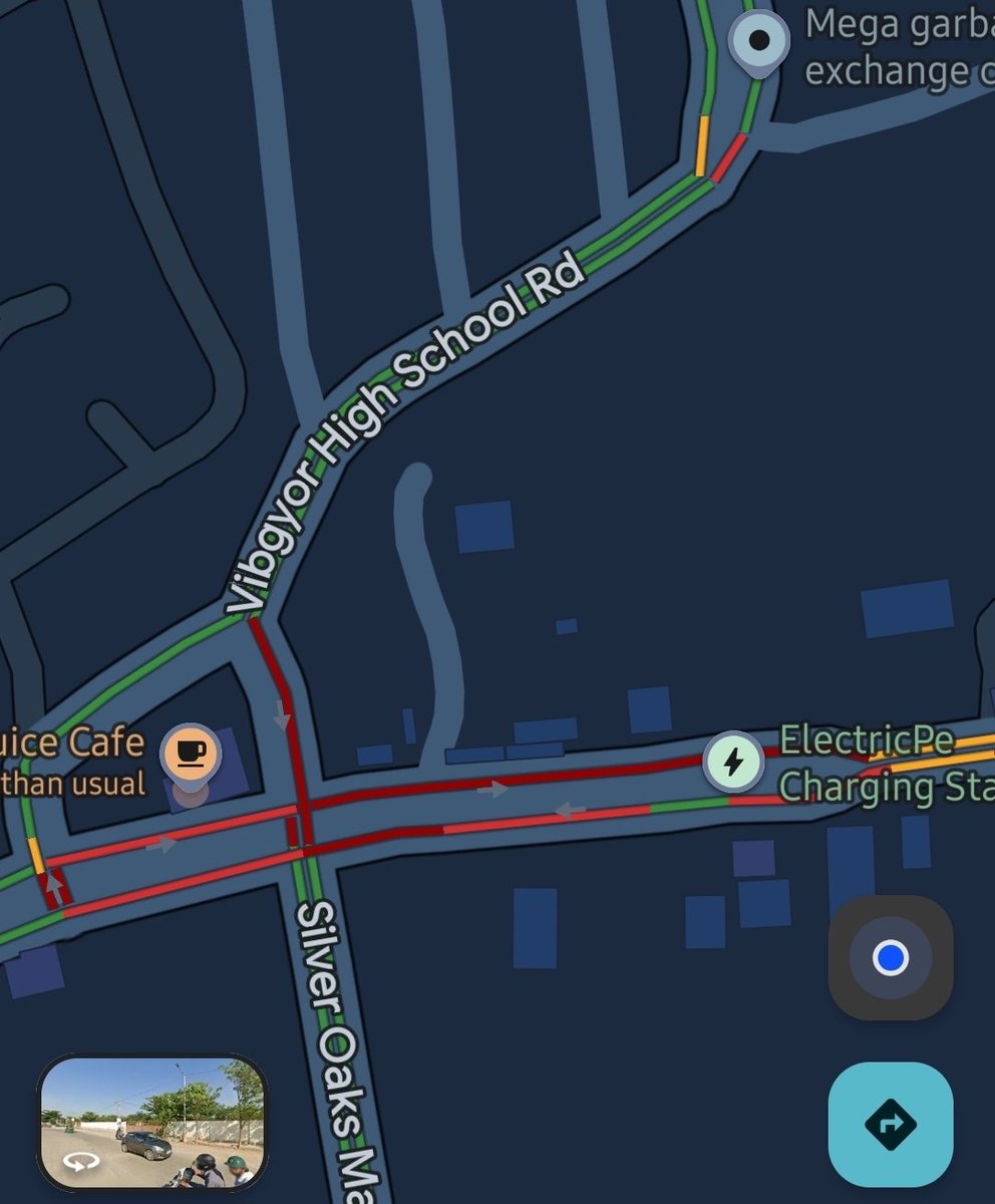 CitizenPulseX's tweet photo. The Balagere T-junction is jam-packed at 7:15 PM today, with every approach in deep red, severely choked junction.

This is not a one-off. It is a daily failure of traffic management. Thousands of commuters lose hours here because no personnel are visible at the junction during peak hours. There is no signal or marshal to regulate turns, and nothing is done about wrong-side driving, blocking the box, or roadside parking and stopping near the cafe and charging station.

@blrcitytraffic @wftrps @ManjuTraffic @halairporttrfps, a junction this critical needs :
(1) trained personnel deployed 5–9 PM, 
(2) a signal or timed phase system  (3) strict enforcement against encroachment and wrong-side driving, and 
(4) restricted heavy-vehicle movement during peak hours.

Commuters aren't asking for much, just a junction that works. We hope to see visible action soon.

@ChristinMP_  @TVMohandasPai