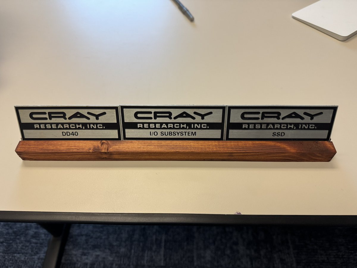 JDMaloney's tweet photo. In today’s episode of vintage HPC/Storage hardware, I finished staining a stand for some old Cray I/O related plaques from the X-MP/Y-MP days #hpc #hpcstorage #cray https://t.co/apynSbv4bP