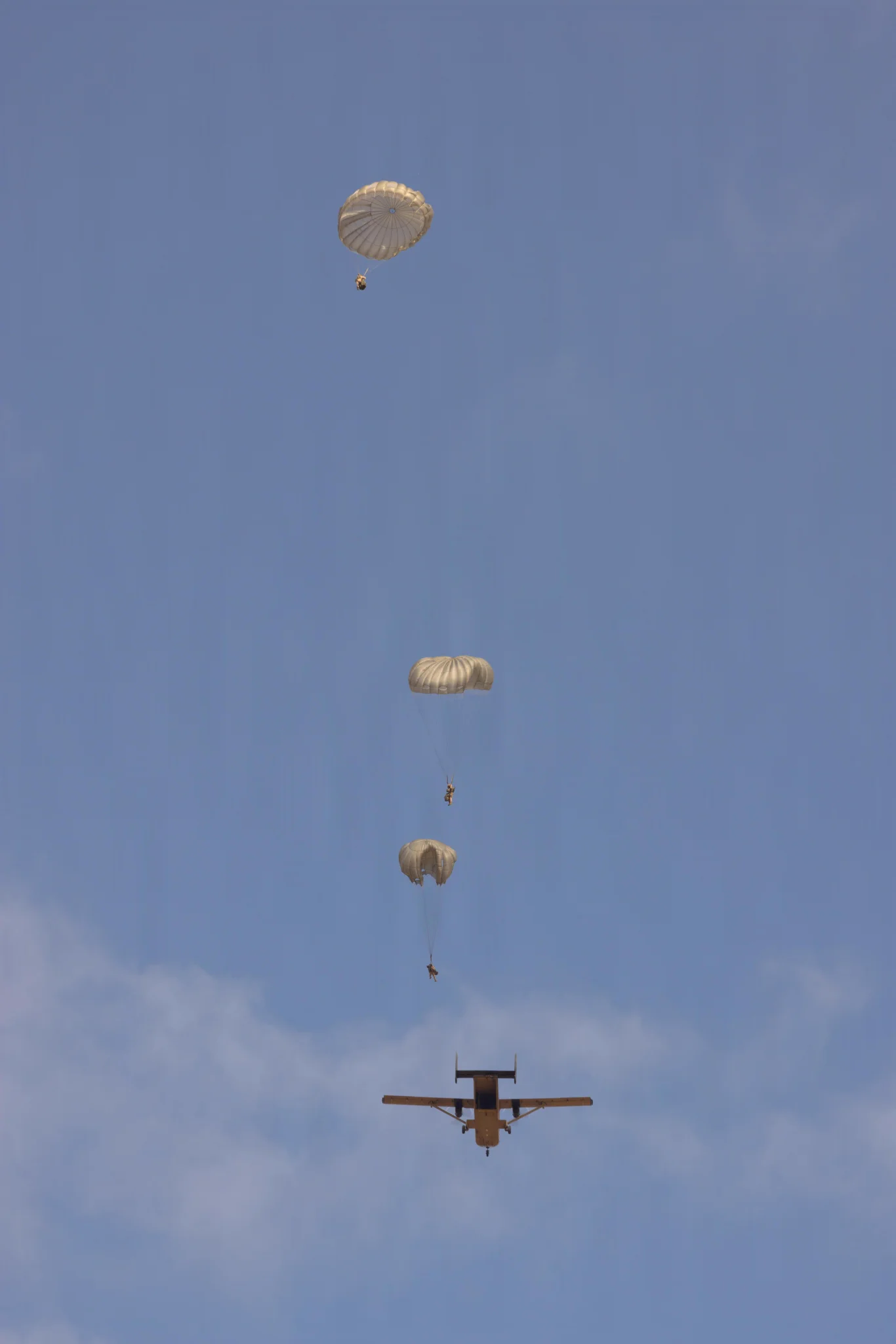 U.S. Marines with 1st Distribution Support Battalion, 1st Marine Logistics Group, jump from an SC-7 Sky Van during a low-level static line parachute jump at Lake Elsinore, California, Sept. 17, 2026. The training enabled the Marines to maintain proficiency in air delivery as well as to verify tactics, techniques, and procedures. (U.S. Marine Corps photo by Cpl. Ryan Ramsammy)