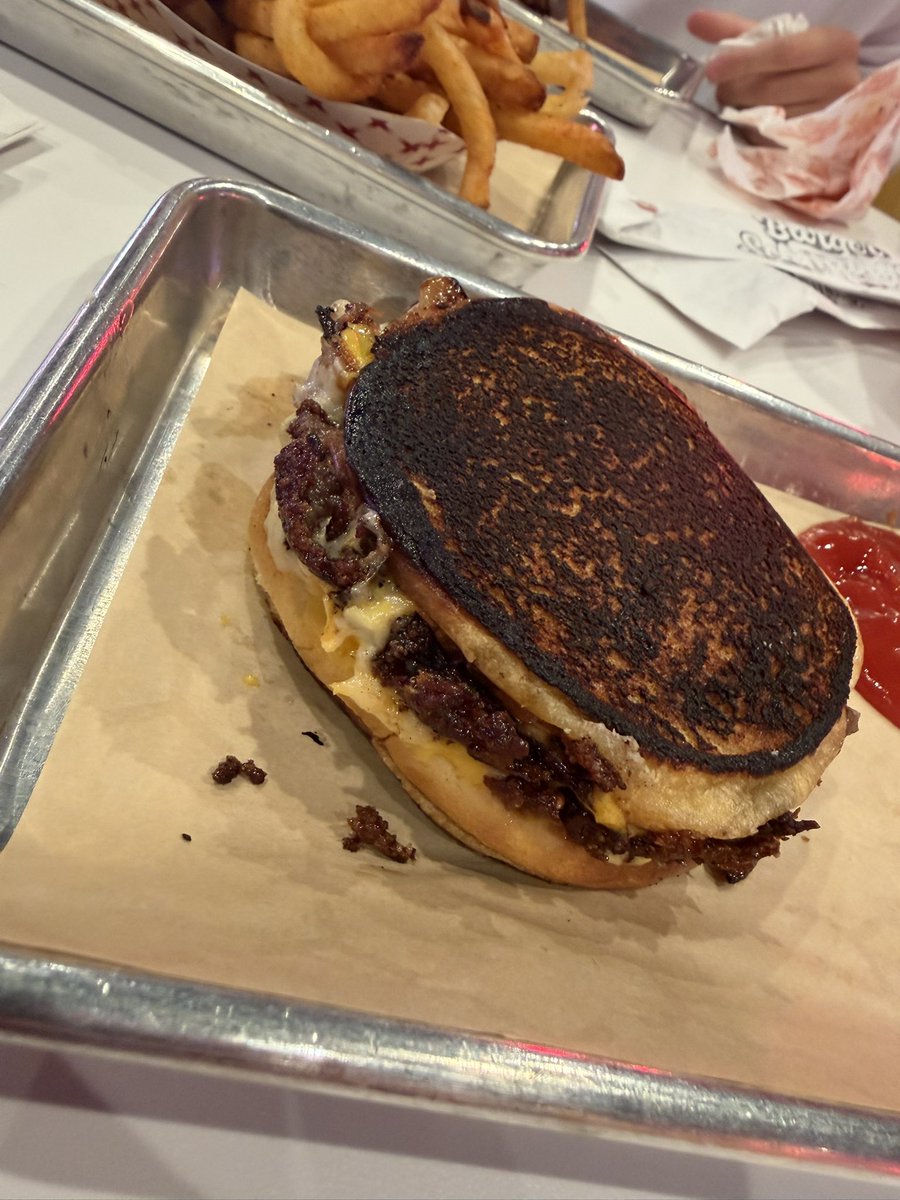 bryanfilker's tweet photo. Stop 12:

Burger Schmurger

718 N Buckner Blvd Suite 100, Dallas TX 75218

Distance to Weber: 
5.2 miles 

SMU decor: 
Nope 👎 

Time from order to receiving food:
7 mins 32 secs

Cost: 
$12.00 

Experience: hot and fresh burger, smash burger 🥲 bun was burnt, not ideal.. flavorful, price point meh for a smash burger, second attempt at coming here last time it was an hour and a half wait. Kind of old school soda grill type of feel, no SMU memorabilia, staff relatively friendly. Got here upon opening to avoid a long wait, and generally underwhelmed with the overall experience, not sure if I understand the long wait time for a Friday afternoon lunch time window we experienced previously. 

Guest eater: @BentonLeDouxFB my first even repeat guest, loved the decor and overall vibe of the restaurant, agreed with a pretty average food experience.

Grade: 
2.25 👅 out of 5.