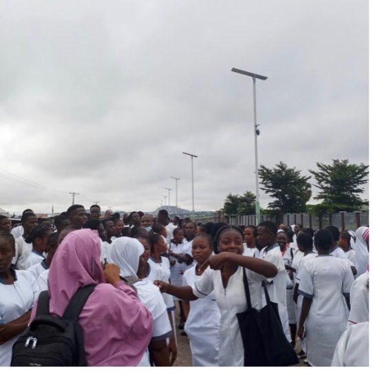 instablog9ja's tweet photo. Nursing students protest in Taraba after hoodlums break into female hostel, r@pe student

Students of the Taraba State College of Nursing Sciences, Jalingo, protested on Monday following an att@ck on one of the female hostels located outside the institution’s premises.

The att@ck reportedly occurred in the early hours of Monday, with hoodlums ste@ling students’ phones and other valuables and allegedly r@ping one of the female students. The student, whose identity was withheld, was taken to a private hospital in the Mile 6 area of Jalingo for treatment.

A student union official, who spoke anonymously, said it was the second att@ck on the students’ hostels within two weeks.

“Yesterday night, the hoodlums came in their numbers and attacked one of the female students’ hostels. They r@ped one of the students and also carted away phones belonging to the students and other valuables.

“They also c¥t one of the fingers of the student after r@ping her. She is now on admission at a private hospital located at Mile 6 area in Jalingo.

“When the first att@ck happened last week, we complained to the school authorities and the Commissioner of Tertiary Education visited the college and promised that security measures would be put in place in all the hostels, but nothing was done,” he said.

The official said the college has seven hostels, one for males and six for females, but all are located outside the school premises without adequate security.

The Provost, Dr Dorcas Dugule, acknowledged the report, saying, “I am on top of the issue. I will not speak; please give me time.”

The Taraba State Police spokesperson, Victor Mshelizah, confirmed the attack but said he was unaware of the r@pe allegation.

“Yes, such incident happened in the early hours of today. Some hostels were burgled and phones were st%len. But I cannot confirm the r@pe allegation because I haven’t seen the victim,” he said, adding that officers were heading to the school.