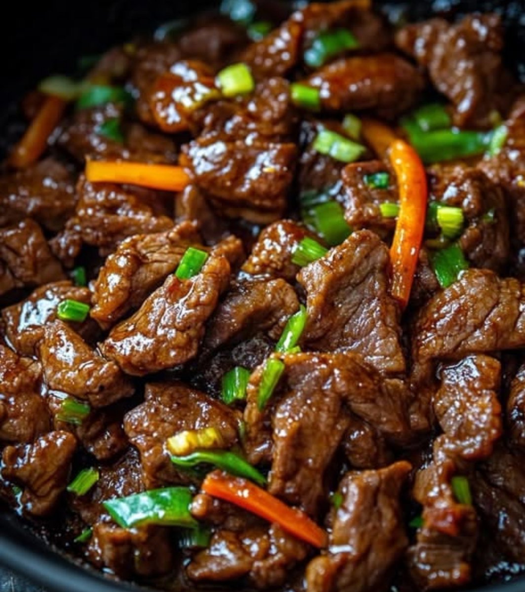 LabMariam48488's tweet photo. Mongolian Beef

Yield: 3–4 servings
Prep Time: 15–20 minutes
Cook Time: 10–12 minutes
Total Time: 30–35 minutes

Ingredients

Beef

- 450 g flank steak or sirloin, thinly sliced against the grain
- 30 g cornstarch (2 tbsp)
- ¼ tsp salt
- 30–45 ml neutral cooking oil (2–3 tbsp)

Vegetables

- 4–5 green onions, cut into 2.5 cm pieces
- 1 small carrot, cut into thin matchsticks, optional

Sauce

- 80 ml low-sodium soy sauce
- 80 ml water
- 65 g brown sugar
- 3–4 garlic cloves, finely minced
- 5 g fresh ginger, finely minced
- ½ tsp chili flakes or 1 tsp chili oil, optional
- 5 ml sesame oil

Optional Thickening Slurry

- 5 g cornstarch
- 15 ml cold water

Method

1. Prepare the beef: Slice the beef thinly against the grain. Toss with cornstarch and salt until evenly coated. Rest for 10–15 minutes.

2. Prepare the sauce: Combine soy sauce, water, brown sugar, garlic, ginger, chili, and sesame oil. Mix well and set aside.

3. Sear the beef: Heat a wok or large skillet over high heat. Add oil and sear the beef in small batches for approximately 45–60 seconds per side, until browned. Remove and set aside.

4. Stir-fry vegetables: Add a little more oil if necessary. Stir-fry the carrot and the white portions of the green onions for 30–45 seconds.

5. Add aromatics: Add garlic and ginger and stir-fry for approximately 20 seconds, taking care not to burn them.

6. Build the sauce: Pour in the prepared sauce and bring to a simmer. Cook for 1–2 minutes to slightly reduce.

7. Thicken if required: Mix the cornstarch with cold water to form a slurry. Add gradually while stirring until the sauce reaches a glossy, coating consistency.

8. Finish: Return the beef to the pan and toss over high heat for 30–60 seconds, ensuring every piece is coated. Add the green onion tops during the final few seconds.

9. Serve: Serve immediately over steamed rice. Garnish with additional green onions and sesame seeds if desired.

Standardization Notes

- Slice against the grain for maximum tenderness.
- Keep the pan very hot and cook the beef in batches to prevent steaming.
- Add the cornstarch slurry only as needed; the sauce should coat the beef rather than become excessively thick.
- For a less sweet profile, reduce brown sugar to 50 g.
- For food safety, cook beef to the required safe internal temperature for the intended service and maintain appropriate hot-holding temperatures when serving commercially.
#MariamFoodLab