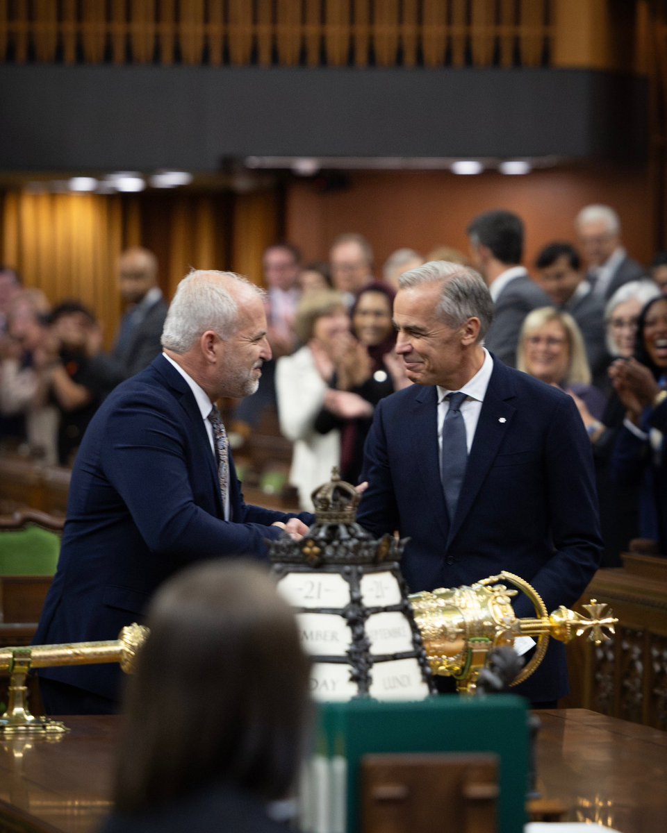 Prime Minister Carney walks into the House of Commons Chamber with MP Daniel Gobeil, in Ottawa, Ontario.