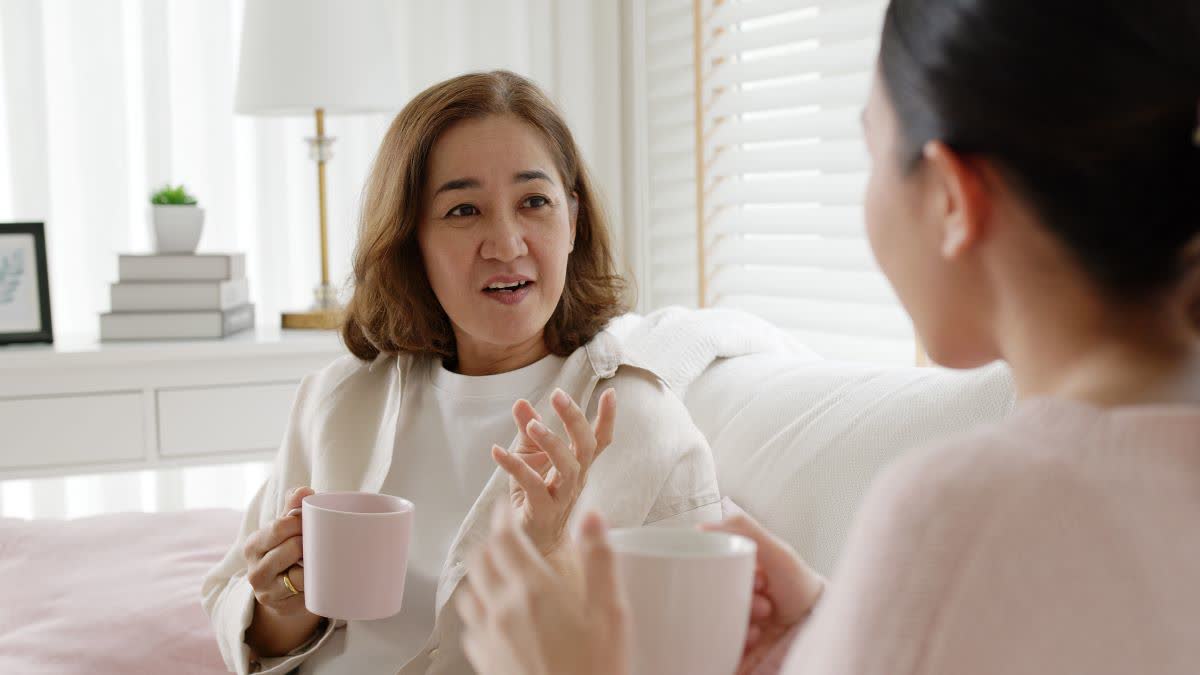 A mother talking with her daughter.