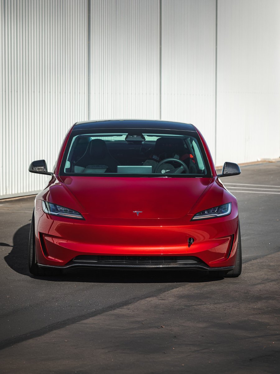 UnpluggedTesla's tweet photo. Real carbon, right where the eye lands first.

Prepreg carbon fiber lip cover, gloss or satin, shaped to the factory bumper lines. No cutting or drilling, about an hour to install, fully reversible.

Fits 2024+ Model 3 Performance. https://t.co/OtcOD7DTwg