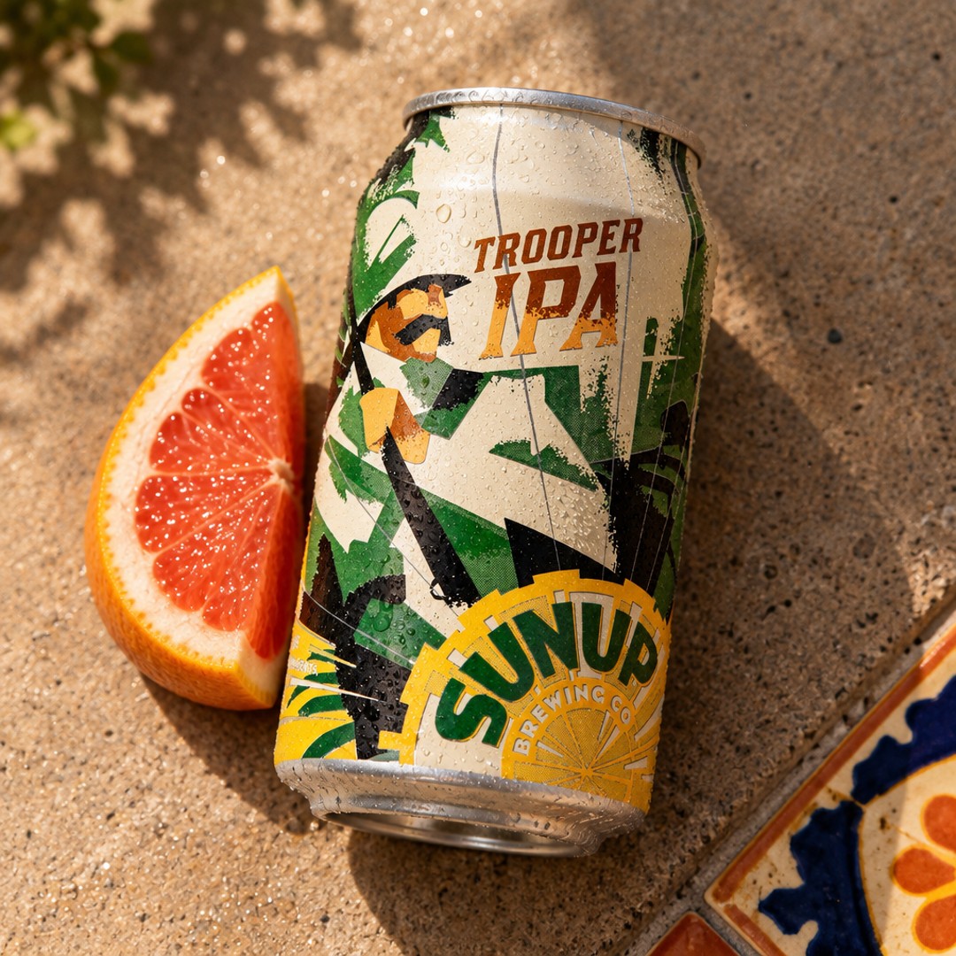 sunupbrewing's tweet photo. A cold can, a grapefruit wedge, and some Arizona shade doing the heavy lifting. That citrus snap is why Trooper shows up with a little backbone instead of acting like a beach beer in the desert. #TrooperIPA #PhoenixBeer #AZCraftBeer https://t.co/OcwNIVQ2K6