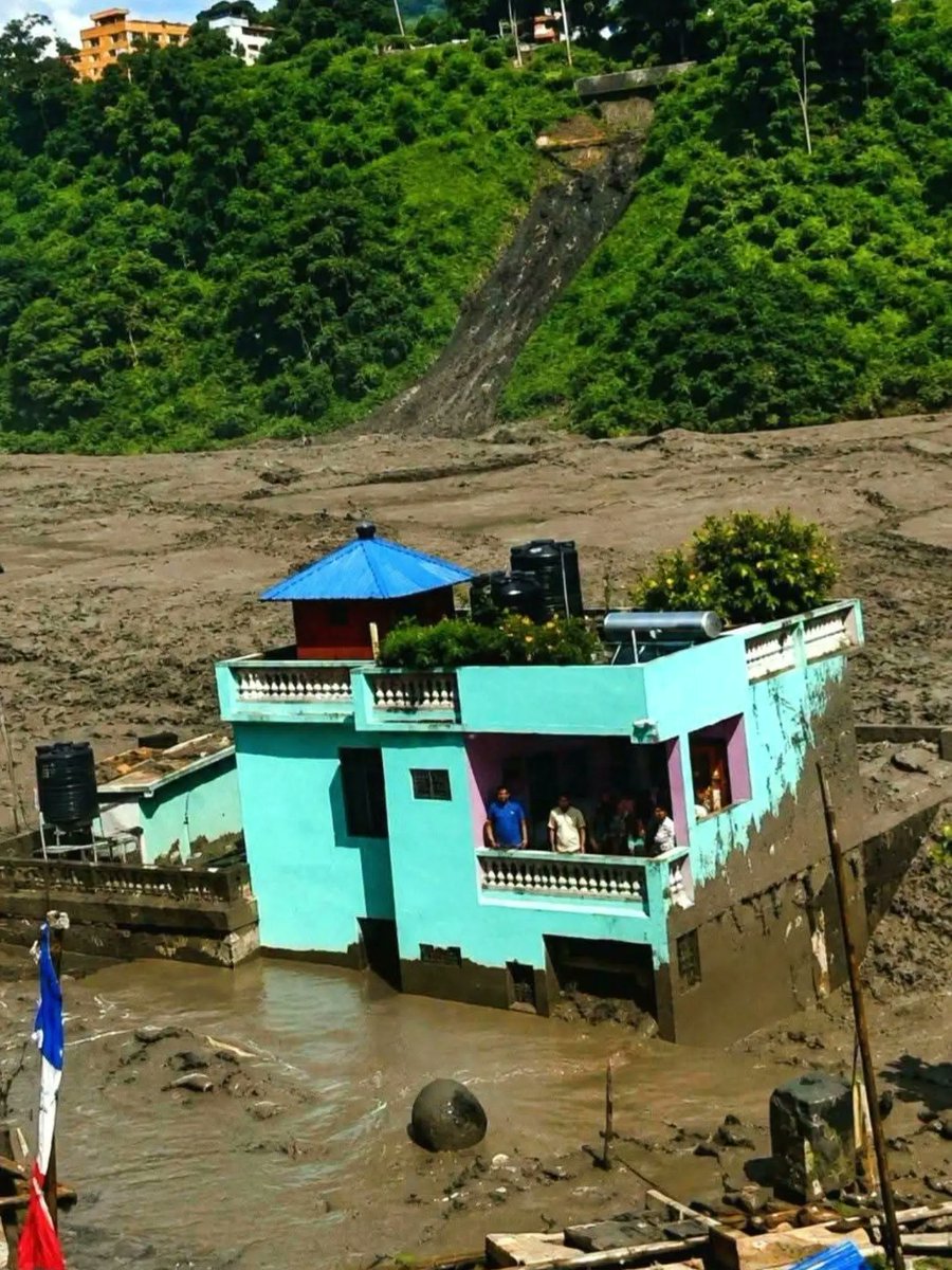 RemonaCrumble's tweet photo. When God intends to save someone, no situation can stop Him. Despite mud and floods all around, this house still stands proudly. Death surrounded it, yet life endured. Even science bows before God’s will. https://t.co/U2PPHHEBDj