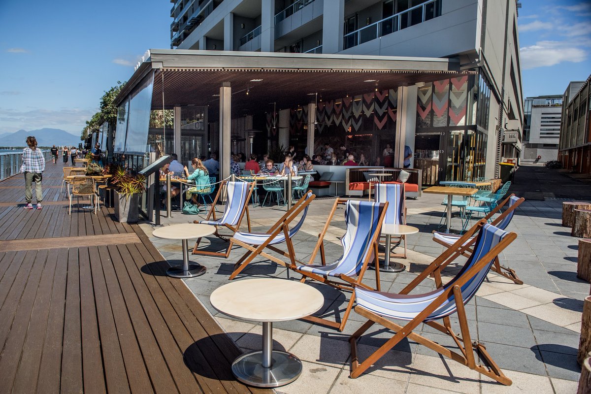 AskMuddie's tweet photo. "Us regulars know that arvo sun sets are best enjoyed with a plate of fresh Coral Sea seafood at Boatshed, Cairns CBD. Get there by 6:30pm to snag a deck table &amp; watch the water go by while you dine! #TuesdayMornings"

https://t.co/H9Mrhq5sxz https://t.co/3ZaraabOAv