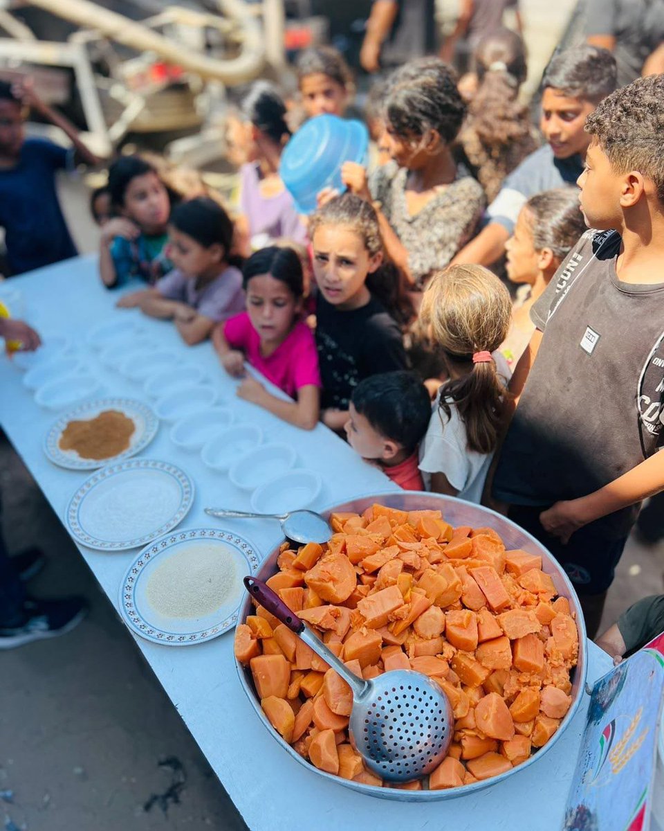 WCKitchen's tweet photo. Sweet potatoes are a beloved treat in Gaza, especially in autumn. The local soil is good for growing the nutrient-dense vegetable, and they’re a popular street food around this time of year. Teams at WCK-supported community kitchens in Khan Younis prepared and served plates of roasted sweet potatoes to children, bringing the warm, comforting flavors of the season to life. #ChefsForGaza