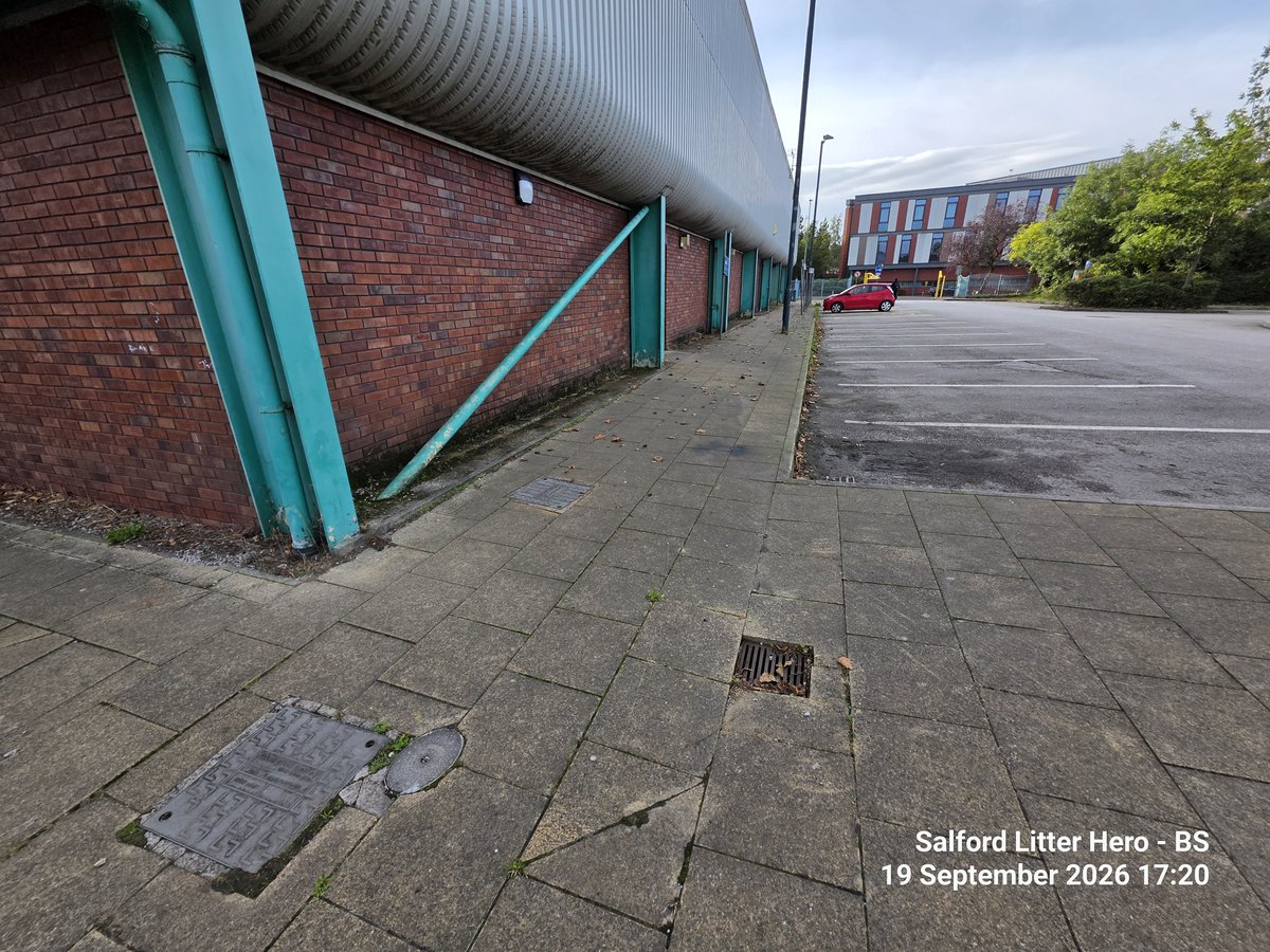LitterGrockle's tweet photo. Hey @SalfordCCHelp can you get this drain looked at which is a tripping hazard in the carpark next to Eccles Leisure Centre please.  Also every (but for one) drain in the carpark needs cleaning out, either full of rubbish, mud or one even has a tree growing out of it https://t.co/xrckmz5IhO