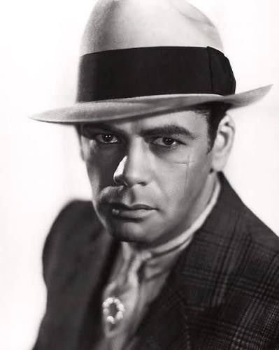 PetronellaWyatt's tweet photo. Happy Birthday Paul Muni
From a modern point of view, Muni occasionally has a whiff of what goes between two slices of bread, but in the 1930s, the star of “Scarface” was one of the biggest names in Hollywood, showing flashes of real brilliance which earned him the privilege of choosing his own parts. Muni was born Frederich Meier Weisenfreund in 1895 in Austria-Hungary. When he was seven, he emigrated with his family to Chicago and was nicknamed “Moony". He started his acting career in the Yiddish theatre. Film historian Robert Osborne writes that his makeup skills were so consummate that for most of his roles, "he transformed himself so completely, he was dubbed 'the new Lon Chaney.'" In 1929, Muni was signed by Fox and his name was anglicised to Paul Muni (derived from his nickname). He received an Oscar nomination for his first film, “The Valiant” (1929) and achieved stardom in provocative pre-Code films such as “I Am a Fugitive from a Chain Gang” and the iconic gangster film “Scarface.” (both 1932). Warner Bros signed him to a long-term contract, publicising him as "the screen's greatest actor." “Scarface” , the film for which Muni is best remembered, was written by Ben Hecht and directed by Howard Hawks, and is worth at least one viewing. Raw, violent yet oddly touching, critic Richard Corliss commented in 1974 that while it was a conventional gangster movie, it also "managed to congratulate journalism for its importance, and to chastise it for its chicanery, by underlining the newspapers' complicity in promoting the underworld image." In 1935, Muni persuaded Warner Bros. to produce “The Story of Louis Pasteur”, the first of the actor’s biographical roles, for which he won an Oscar. Muni played several historical figures, including Zola in “The Life of Emile Zola” (1937), which won Best Picture and was seen as an attack on the repression of Nazi Germany. He also played the lead role in “Juarez” (1939), opposite Bette Davis, and portrayed a Chinese peasant in “The Good Earth.” The makeup was grotesque, and the part should have gone to an Asian, but, hey, in Old Hollywood that was an impossibility. To his credit, when Irving Thalberg offered him the role, Muni said, "I'm about as Chinese as Herbert Hoover." Dissatisfied with films, he chose not to renew his contract. Muni returned to the screen occasionally in later years, playing Frédéric Chopin's teacher in the unintentionally hilarious “A Song to Remember” (1945). In 1946, he gave a winning performance in a comic role in “Angel on My Shoulder”. Muni’s final part was as a doctor in “The Last Angry Man” (1959). After that, he retired from acting due to his failing eyesight and other health problems. Muni was noted for his intense preparation for his roles. Before playing Pasteur, the actor said he “read every book on him” and found an old woman who had met him, and who remembered his mannerisms. The New York Times commented, “to Paul Muni, acting was not just a career, but an obsession", and Arthur Miller believed that Muni "was pursued by a fear of failure." Extremely eccentric, he objected to anyone wearing red in his presence, and often played the violin between takes. Although Muni was considered one of the greats, and was hero-worshiped by Marlon Brando, some film critics, such as David Thomson and Andrew Sarris, accuse him of overacting. Thomson describes Muni as "a crucial negative illustration in any argument as to what constitutes screen acting." William Dieterle, who directed him in his three biopics, also called Muni “a slight ham at times.” Having seen four of his films, I have to admit that some of his performances haven’t travelled well. Muni died of a heart disorder in Montecito, California in 1967 at the age of 71.