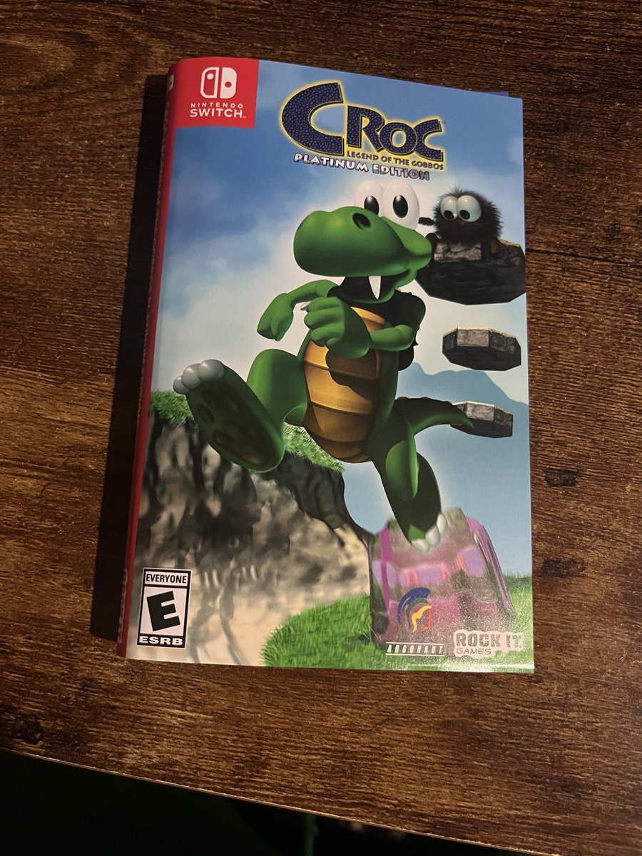 Arsenalof1's tweet photo. @RockitGamesNOW I received my copy of Croc today! It came with an interesting thing: An extra cover wrapped around the sealed game. Im curious on the story of this! 😁 also can I say that this game and manual looks clean 🤤 I should have gotten the collectors edition. https://t.co/wdlnL24YuR