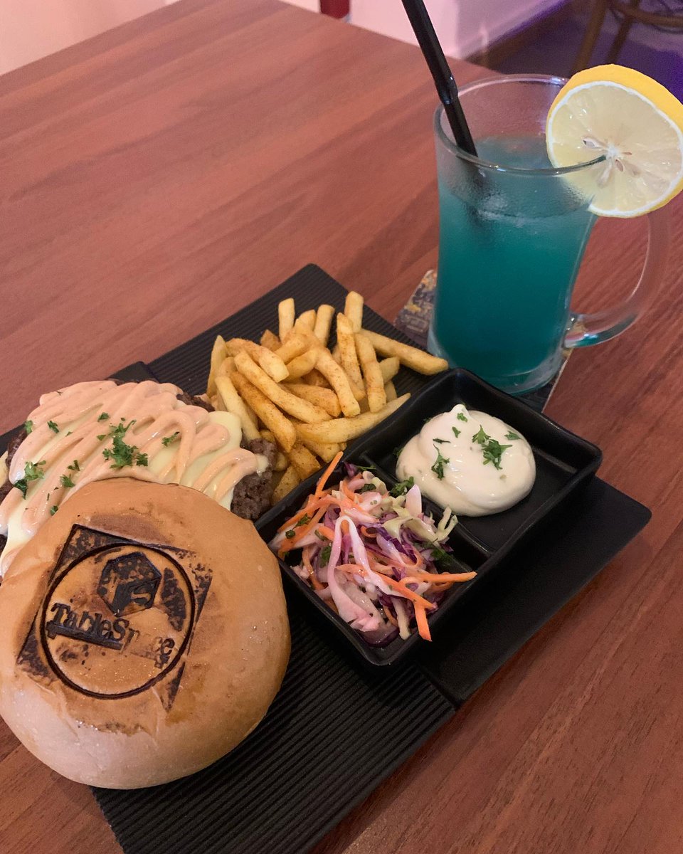 audreyrobir7e4's tweet photo. Tried Tablespace for the first time and loved how the menu items are named after iconic games. I ordered the Smash Bros burger: a thick, chunky beef patty with crisp lettuce, tangy TBS sauce, tomato, melted cheese, and a toasted bun. It came with https://t.co/U8ljwfNwBq