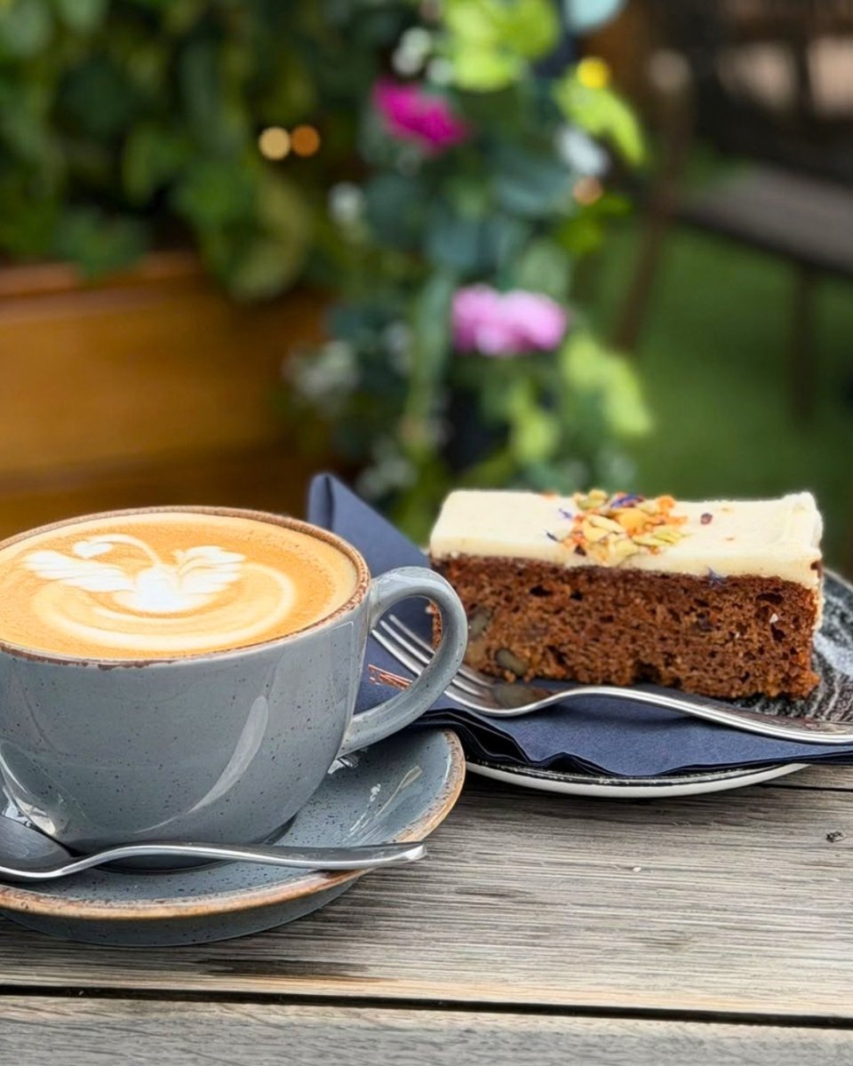 ProjectCoffeeUK's tweet photo. Coffee &amp; Carrot Cake! 🧡😊
A lightly spiced &amp; super moist carrot and orange sponge, dotted with juicy sultanas, coconut, and chunky walnut pieces. 

Paired with a silky smooth latte at #ProjectCoffee
What more could you want? 
Visit today 📍 #TadpoleGardenVillage #Swindon https://t.co/EvVhXsWoN2