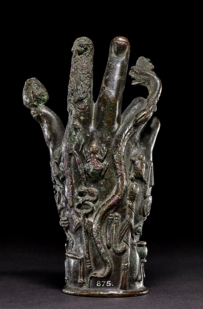 CEERS1749's tweet photo. 🟥Sabazios

In the ancient Mediterranean world, there was an enigmatic yet profoundly influential deity from Phrygian mythology—Sabazios.

He originated in west-central Turkey. Later, with the expansion of the Hellenistic era and the Roman Empire, he was carried across the entire Mediterranean world. 

Many scholars believe he shares complex connections with the wine god Dionysus, Zeus, and even Eastern mystery religions.

In the Antiquities collection, Sabazios's most famous relic is not a statue of the god himself—but a "bronze hand."

These ritual objects, known as the "Hand of Sabazios," are typically crafted as a raised right hand, as if performing a blessing or a mystic ritual. 

The palm and fingers are often covered with symbolic elements:

· Snake — rebirth, the underworld, and hidden knowledge
· Frog — fertility and the cycle of life
· Lizard — transformation and regeneration
· Pinecone — Dionysian ecstasy and spirituality
· Divine figures and altars — sacrificial rites in mystery religions

These elements, mixed together, give the worship of Sabazios a powerful aura of "Eastern mysticism."

Many researchers believe these religions did not emphasize public sacrifice, but rather resembled a secret, "initiatory" faith. 

Through ritual, music, Dionysian ecstasy, and symbols, worshippers sought an experience of communion with the divine.

Interestingly, the raised-hand gesture of Sabazios may have even influenced the early Christian gesture of blessing.