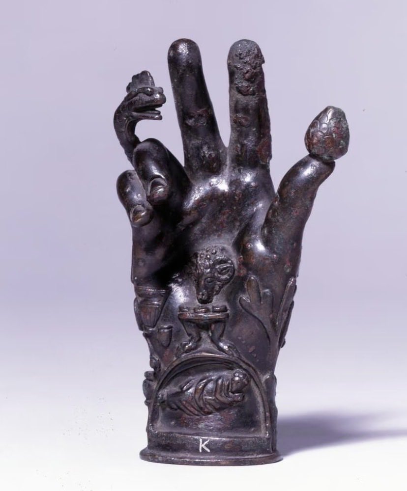 CEERS1749's tweet photo. 🟥Sabazios

In the ancient Mediterranean world, there was an enigmatic yet profoundly influential deity from Phrygian mythology—Sabazios.

He originated in west-central Turkey. Later, with the expansion of the Hellenistic era and the Roman Empire, he was carried across the entire Mediterranean world. 

Many scholars believe he shares complex connections with the wine god Dionysus, Zeus, and even Eastern mystery religions.

In the Antiquities collection, Sabazios's most famous relic is not a statue of the god himself—but a "bronze hand."

These ritual objects, known as the "Hand of Sabazios," are typically crafted as a raised right hand, as if performing a blessing or a mystic ritual. 

The palm and fingers are often covered with symbolic elements:

· Snake — rebirth, the underworld, and hidden knowledge
· Frog — fertility and the cycle of life
· Lizard — transformation and regeneration
· Pinecone — Dionysian ecstasy and spirituality
· Divine figures and altars — sacrificial rites in mystery religions

These elements, mixed together, give the worship of Sabazios a powerful aura of "Eastern mysticism."

Many researchers believe these religions did not emphasize public sacrifice, but rather resembled a secret, "initiatory" faith. 

Through ritual, music, Dionysian ecstasy, and symbols, worshippers sought an experience of communion with the divine.

Interestingly, the raised-hand gesture of Sabazios may have even influenced the early Christian gesture of blessing.