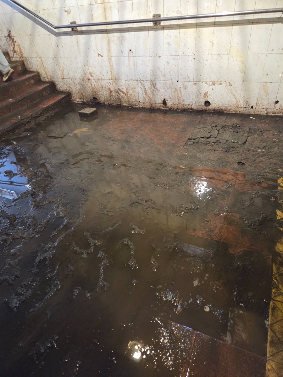 AmitPatil2023's tweet photo. The pedestrian underpass next to **Devipada Metro Station, Western Express Highway** is in a terrible state—stagnant dirty water, mud, seepage and damaged flooring are making it unsafe for pedestrians.

 @mybmc @mybmcWardRC  Take urgent action to clean, repair and maintain. https://t.co/5mYci3LPMf