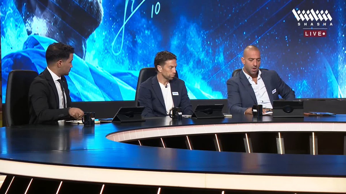 Three men in suits sit at a curved studio desk in front of a large screen displaying a blue graphic with "10" visible, with the "SHASHA LIVE" logo in the top right corner, appearing to host a sports discussion program. The setup corresponds to the analytical studio covering the showdown of Messi's retirement, where Mido discusses how Argentina's national team players' performance levels rise by 30% when playing alongside Messi.