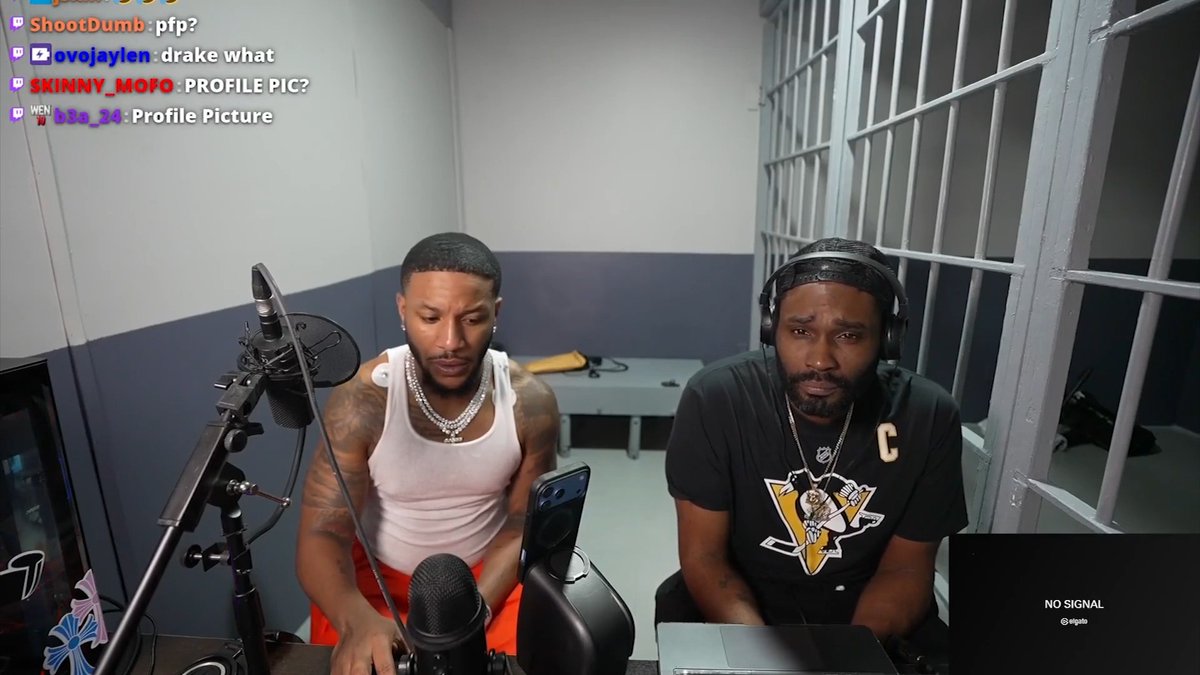 Two men sit in what appears to be a jail cell setting with metal bars, one wearing a white tank top and the other in a black Pittsburgh Penguins jersey, broadcasting live as Twitch chat asks about their "pfp" (profile pic). The stream shows the men looking at a phone, consistent with the caption's reference to Drake calling BenDaDonnn during/after his arrest in Texas.
