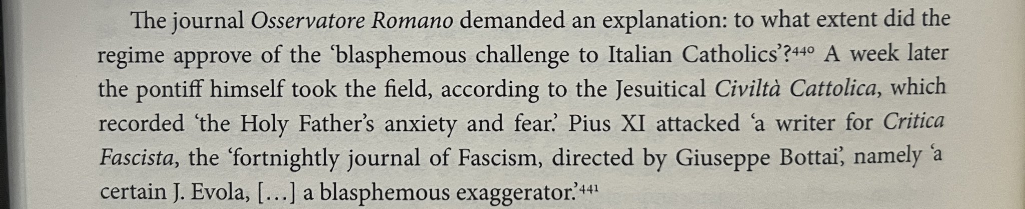 A close-up of a page from a book discussing how Pope Pius XI attacked a writer named 'J. Evola' for the journal 'Critica Fascista', calling him a 'blasphemous exaggerator'.