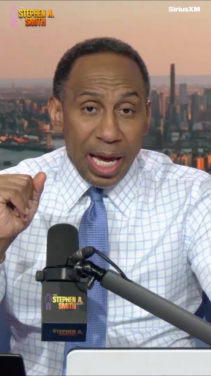Stephen A. Smith is shown mid-speech on "The Stephen A. Smith Show" on SiriusXM, gesturing emphatically toward the camera while speaking into a branded microphone, likely making one of his signature bold takes referenced in the caption "Tell me who's better?!"