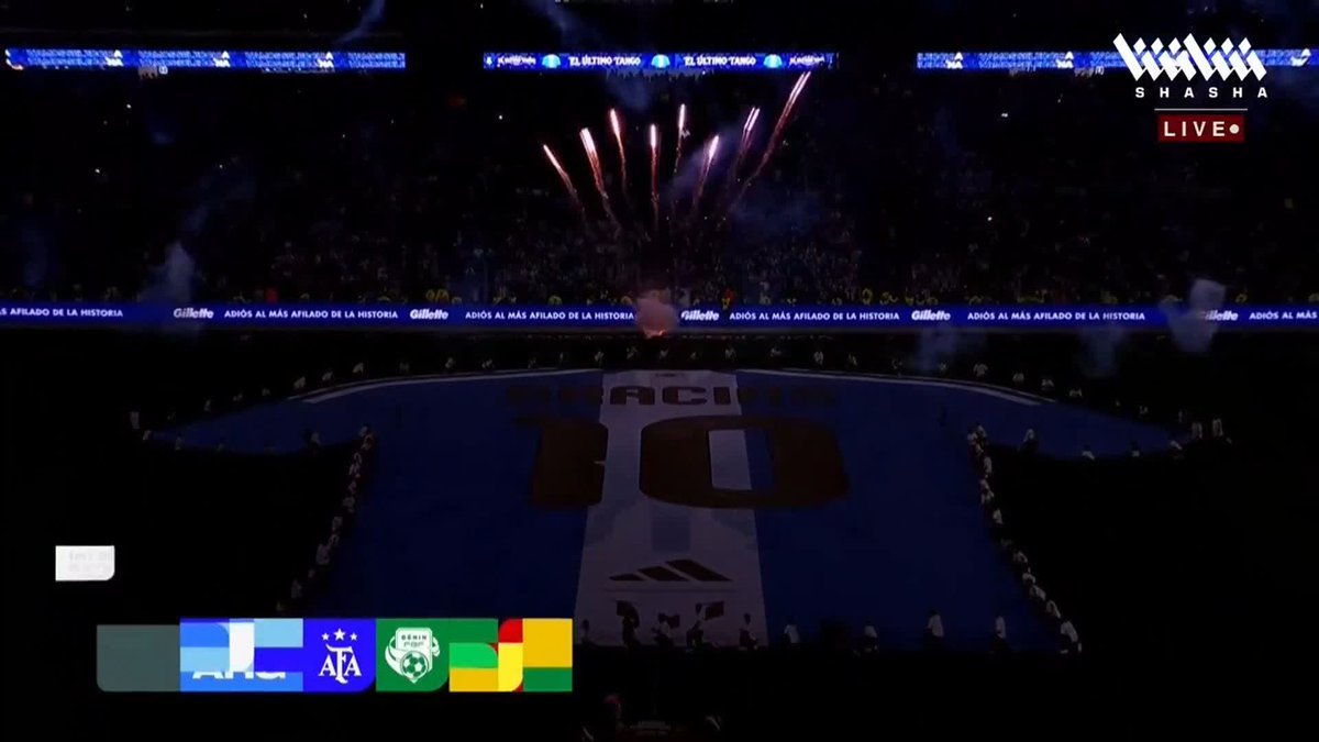 Fireworks explode above the pitch as Messi's retirement match is broadcast on Shasha Live, with the broadcast graphic displaying logos for AFA, ALC, and FOX Sports alongside the text "MESSI 10" emblazoned across the field.