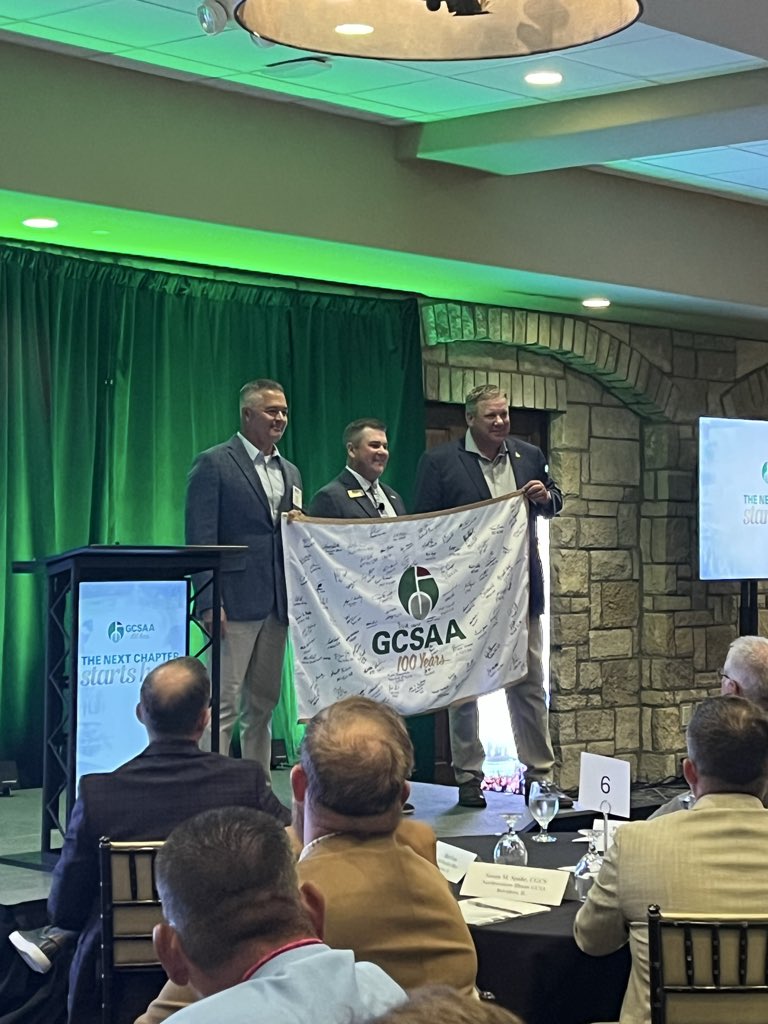 GCSAA_SW's tweet photo. @HawaiiGCSA President Nolan Johnson &amp; Maine Delegate Greg Holder presenting the 100th Anniversary Flag at the opening of today’s @GCSAA Chapter Delegates Meeting.  @SNGCSA @sincitygcsa @SD_GCSA @GCSA_Socal @cactusandpine @gcsanc @GCSACC @HawaiiGCSA @HiLo_GCSA https://t.co/v8j6YIFYxi
