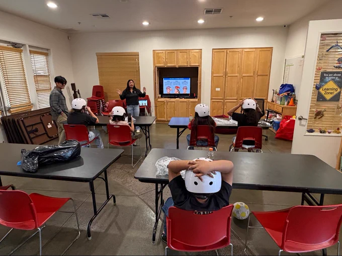 Bike Safety and Helmet Fitting with Solara Apartments via Community Housing Works