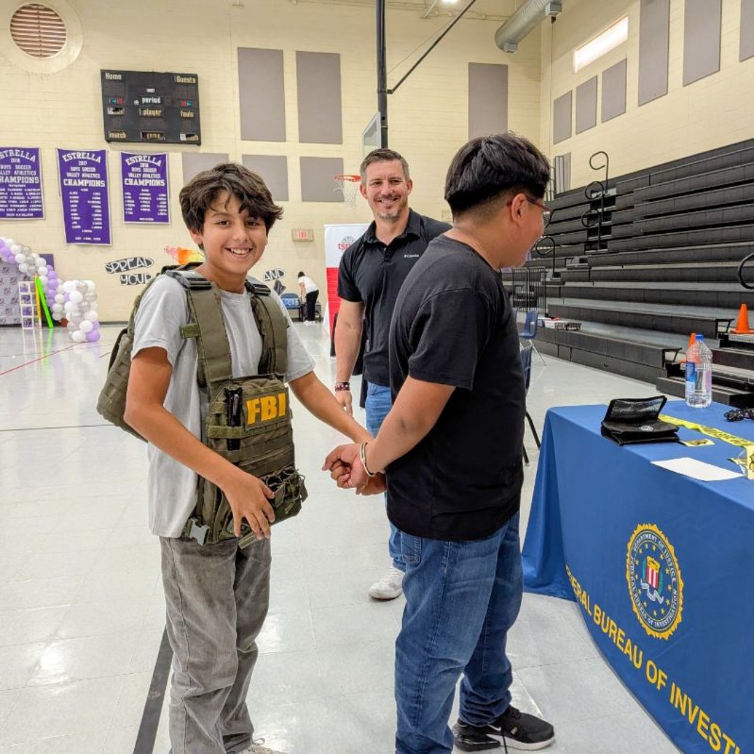 FBIPhoenix's tweet photo. FBI Phoenix had a great time talking with students at Estrella Middle School at the College and Career day. We showed them gear, highlighted different careers and told them what it takes to work at the FBI.

Hopefully we didn't scare them too much by showing what happens if you are on the wrong side of the FBI.