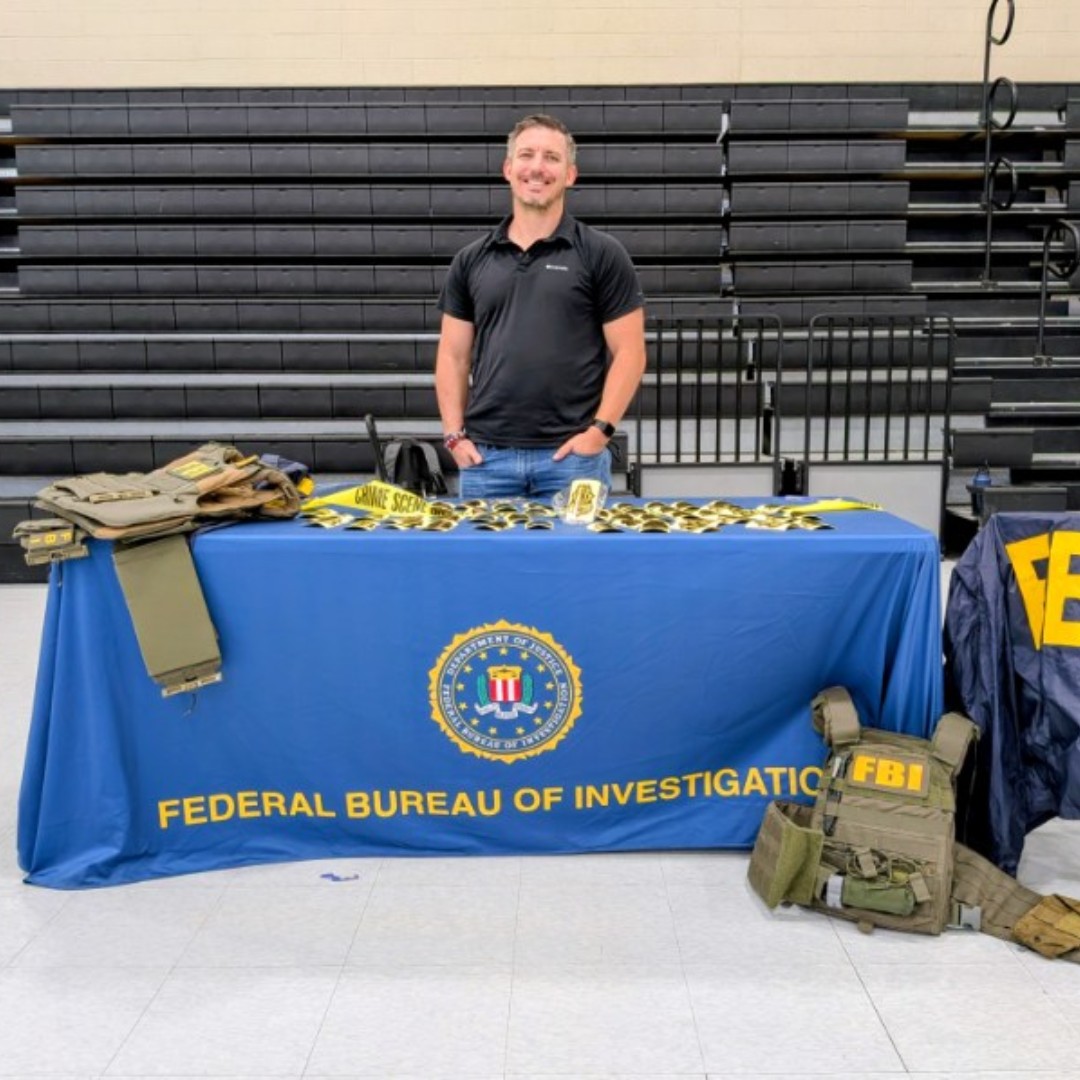 FBIPhoenix's tweet photo. FBI Phoenix had a great time talking with students at Estrella Middle School at the College and Career day. We showed them gear, highlighted different careers and told them what it takes to work at the FBI.

Hopefully we didn't scare them too much by showing what happens if you are on the wrong side of the FBI.