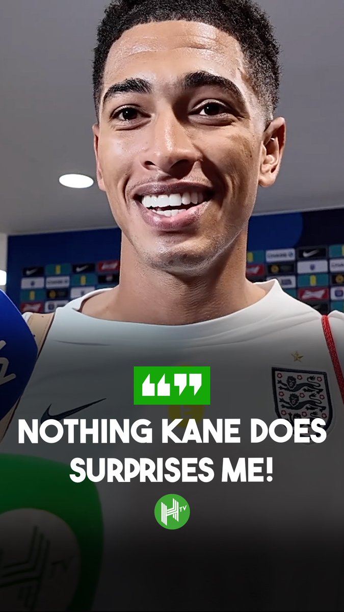 A young England player, likely Jude Bellingham, smiles broadly during what appears to be a post-match interview, wearing the white England national team kit. The caption overlay reads "NOTHING KANE DOES SURPRISES ME!" alongside the "H TV" logo, reinforcing Bellingham's praise for Harry Kane's potential to win the Ballon d'Or.