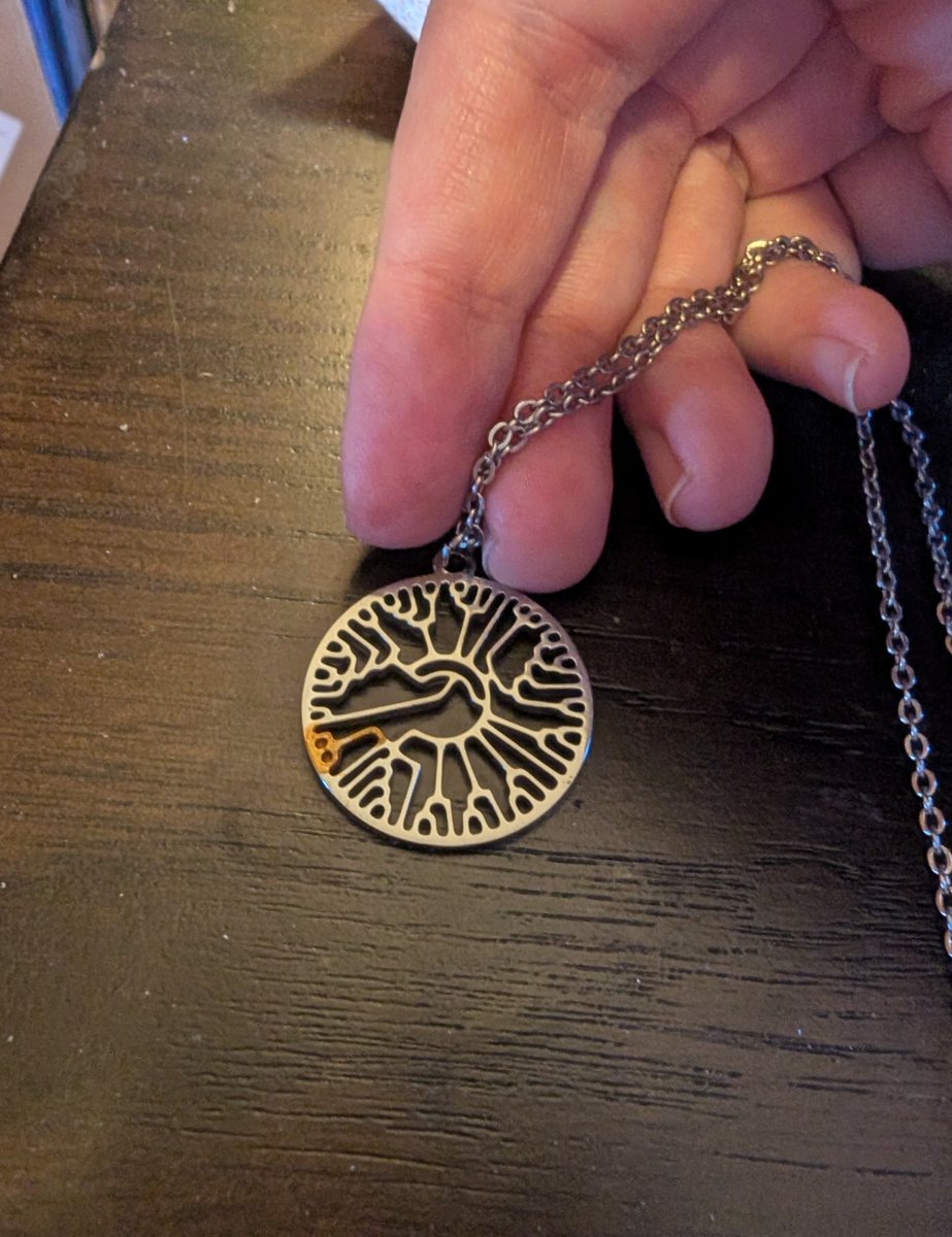 fermatastheorem's tweet photo. found my old 'evolutionary tree of life' necklace and realized it was missing some minds I cared about.  Fable suggested I kintsugi it, of course, so I did https://t.co/YSYFASqVFU