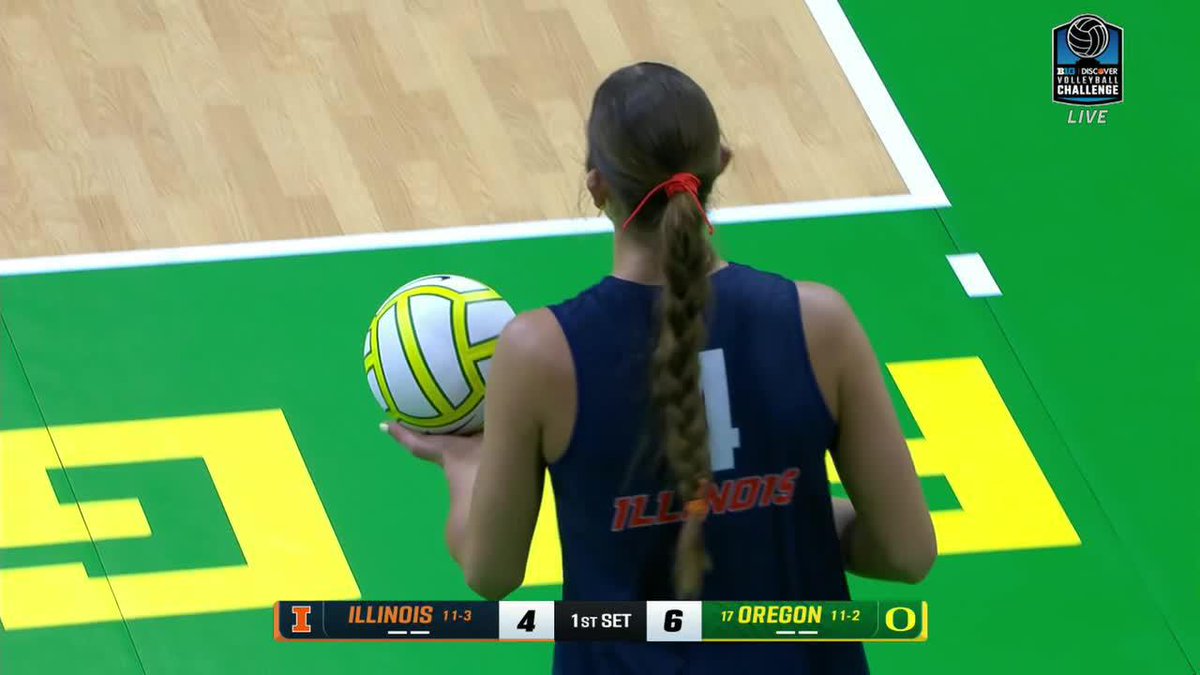A screenshot from the Big Ten Volleyball Challenge showing an Illinois player (#4) holding the ball to serve, with Illinois trailing Oregon 4-6 in the 1st set.