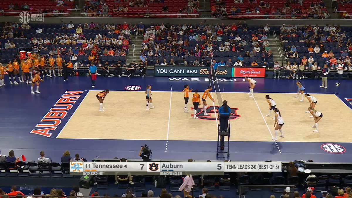 A women's volleyball match between Tennessee (#11) and Auburn (#5) on the Auburn court, with the scoreboard showing Tennessee leading Auburn 7-5.