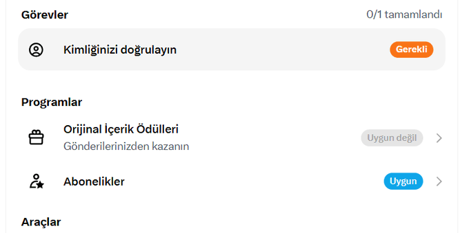 A Turkish-language interface showing 'Görevler' (Tasks) with 'Kimliğinizi doğrulayın' (Verify your identity) marked 'Gerekli' (Required), and programs 'Orijinal İçerik Ödülleri' (Not eligible) and 'Abonelikler' (Eligible).