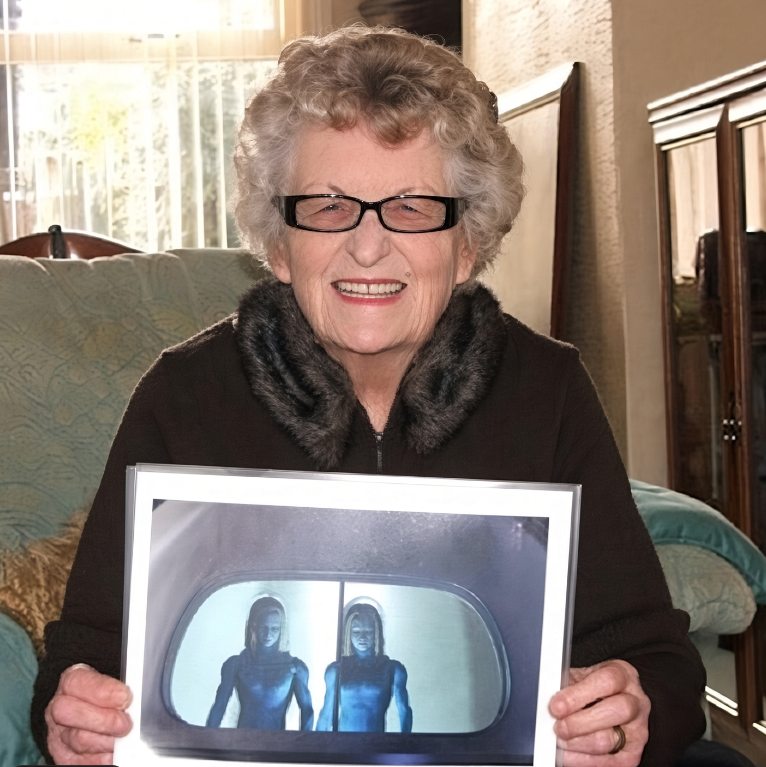 Cortex_Zero's tweet photo. There is something genuinely strange about hearing these two descriptions side by side.

On October 21, 1954, Jessie Roestenberg was at her home near Ranton, Staffordshire, when she said a large silver object appeared above the property. Her two young sons were outside. The craft hovered low enough, according to Jessie, that she could clearly see two occupants through its upper section.

And it was her description of those occupants that always made this case unusual.

They weren't Grays. They weren't monstrous or obviously alien.

Jessie described them as extraordinarily beautiful, human-looking people with pale skin and long golden hair. In one of her later interviews, struggling to find a comparison for what she had seen, she said their hair reminded her of “the old kings” she had seen in pictures.

More than 70 years later, David Grusch has now described alleged non-human bodies he says he observed in footage connected to a retrieval operation.

His description is remarkably similar. It really makes you wonder. #ufox #ufotwitter