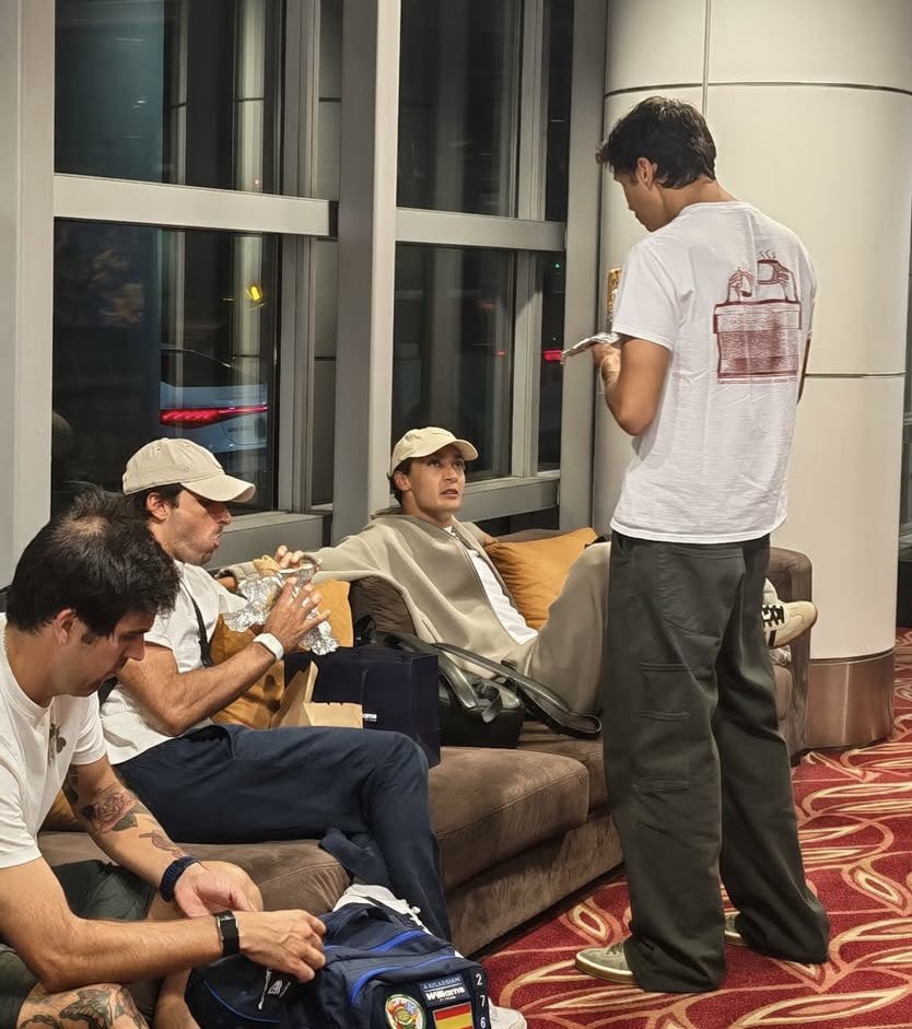 weraugoing's tweet photo. lmaoo george yapping with alex and carlos snacking in the airport https://t.co/ZkWcHSz0zR