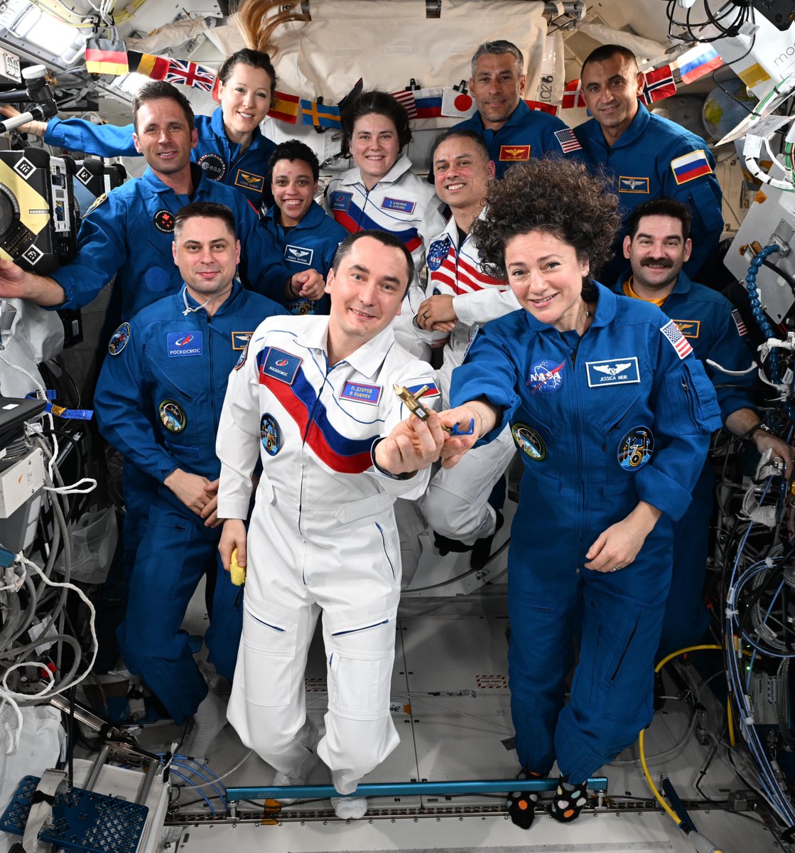 Astro_Jessica's tweet photo. Expedition 75 vibes. It was an honor and privilege to serve as Commander of the @Space_Station! After welcoming Crew-13 this week to mark the second part of Expedition 75, today I handed over the key to the @Space_Station to my friend and colleague Pyotr Dubrov. This ship is in the best of hands!