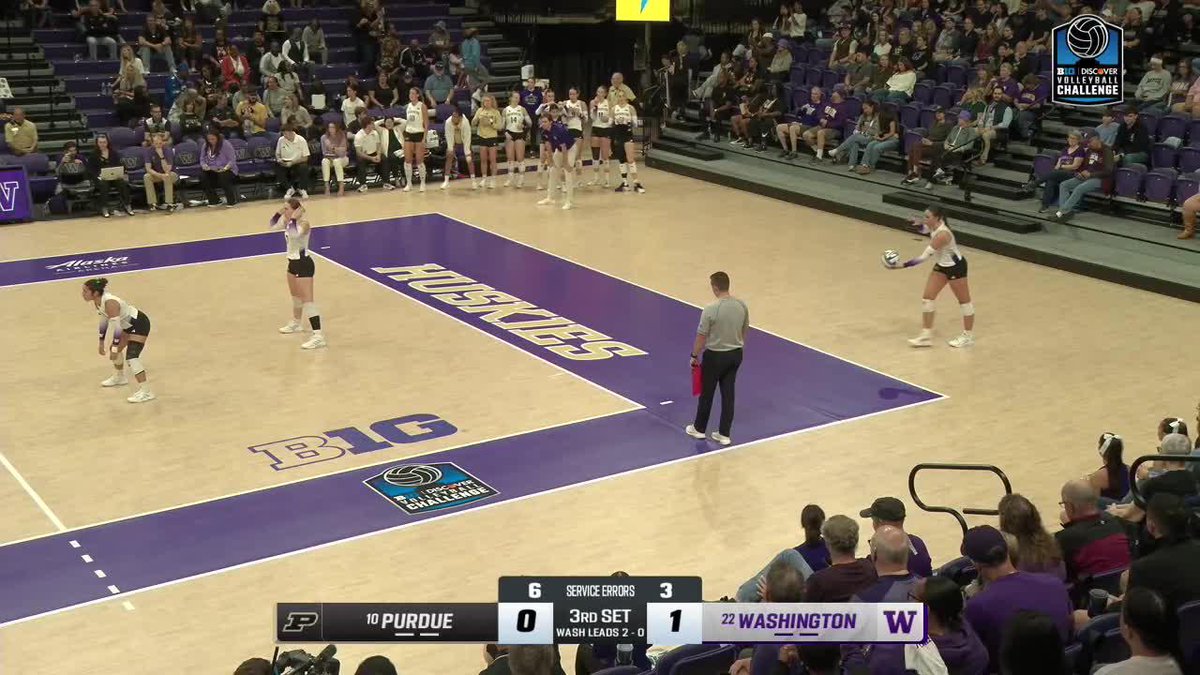 A volleyball match is in progress, with the scoreboard showing #10 Purdue trailing #22 Washington 0 to 1 in the 3rd set, with Washington leading the series 2-0.