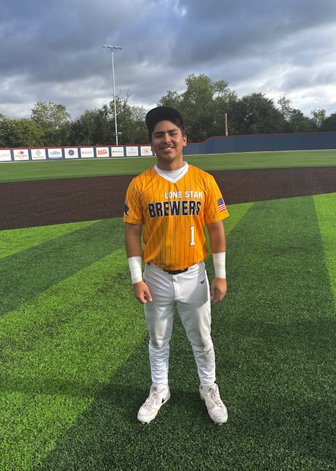 A baseball player wearing a yellow and white striped 'Lone Star Brewers' jersey with the number 1 stands on a baseball field.