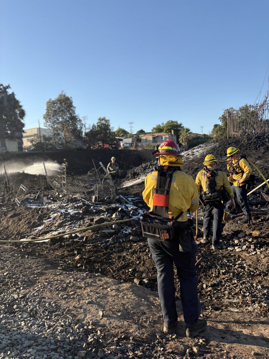 SDFD's tweet photo. Crews will remain on scene near Imperial and Market St after stopping a pair of vegetation fires covering three acres that threatened structures near Lincoln Park. The #MarketFire was reported late this afternoon, SDFD helicopters immediately responded.. (1/3) https://t.co/w9C5adExJu