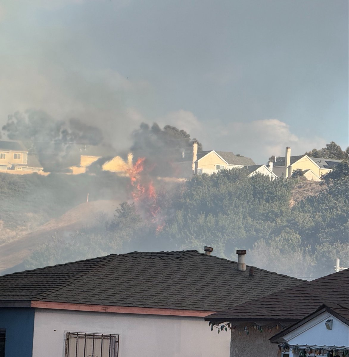 SDFD's tweet photo. Crews will remain on scene near Imperial and Market St after stopping a pair of vegetation fires covering three acres that threatened structures near Lincoln Park. The #MarketFire was reported late this afternoon, SDFD helicopters immediately responded.. (1/3) https://t.co/w9C5adExJu