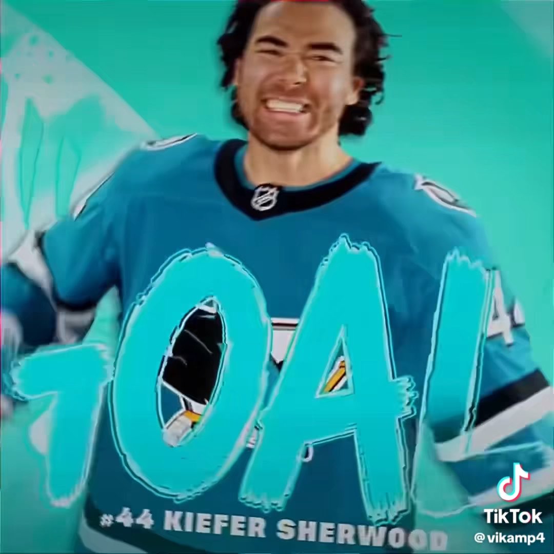 A hockey player identified as Kiefer Sherwood (#44) in a teal San Jose Sharks jersey smiles at the camera, with the text '#44 KIEFER SHERWOOD' and a TikTok handle '@vikamp4' displayed.