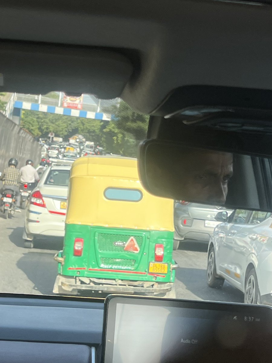 nehagj7's tweet photo. Major jam caused by a careless auto driver who parked on the main road and is sleeping inside the vehicle. They should be made aware of the consequences. There is a massive jam over the flyover coz of this. Munirka to Rao Tula ram stretch as shared many times @dtptraffic https://t.co/C4YK2LkrbV